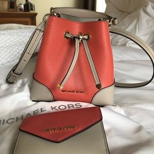Michael Kors 2tone leather purse and matching wallet.